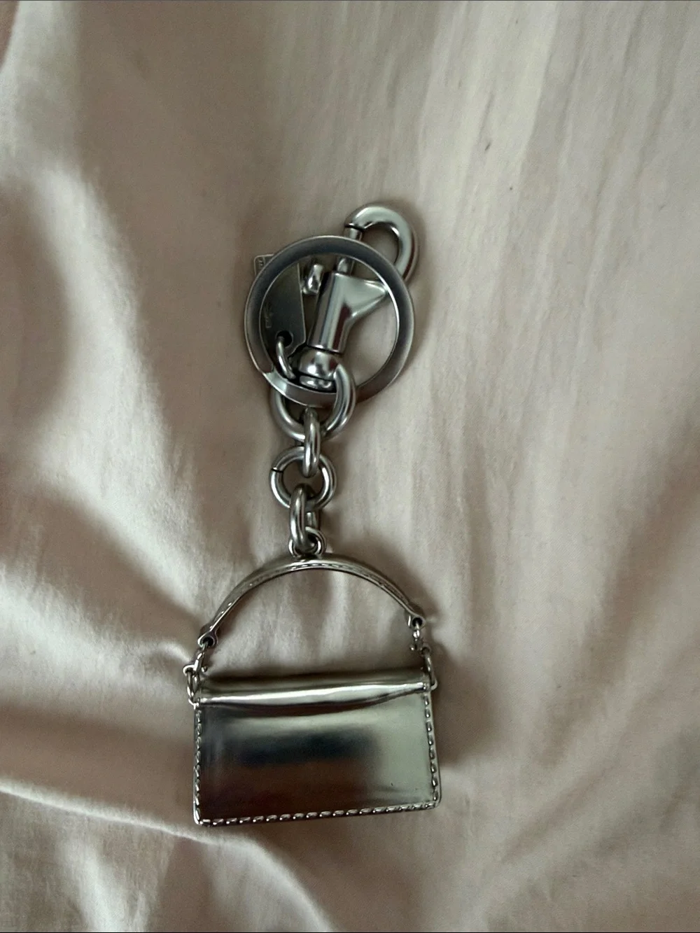 Coach polished silver